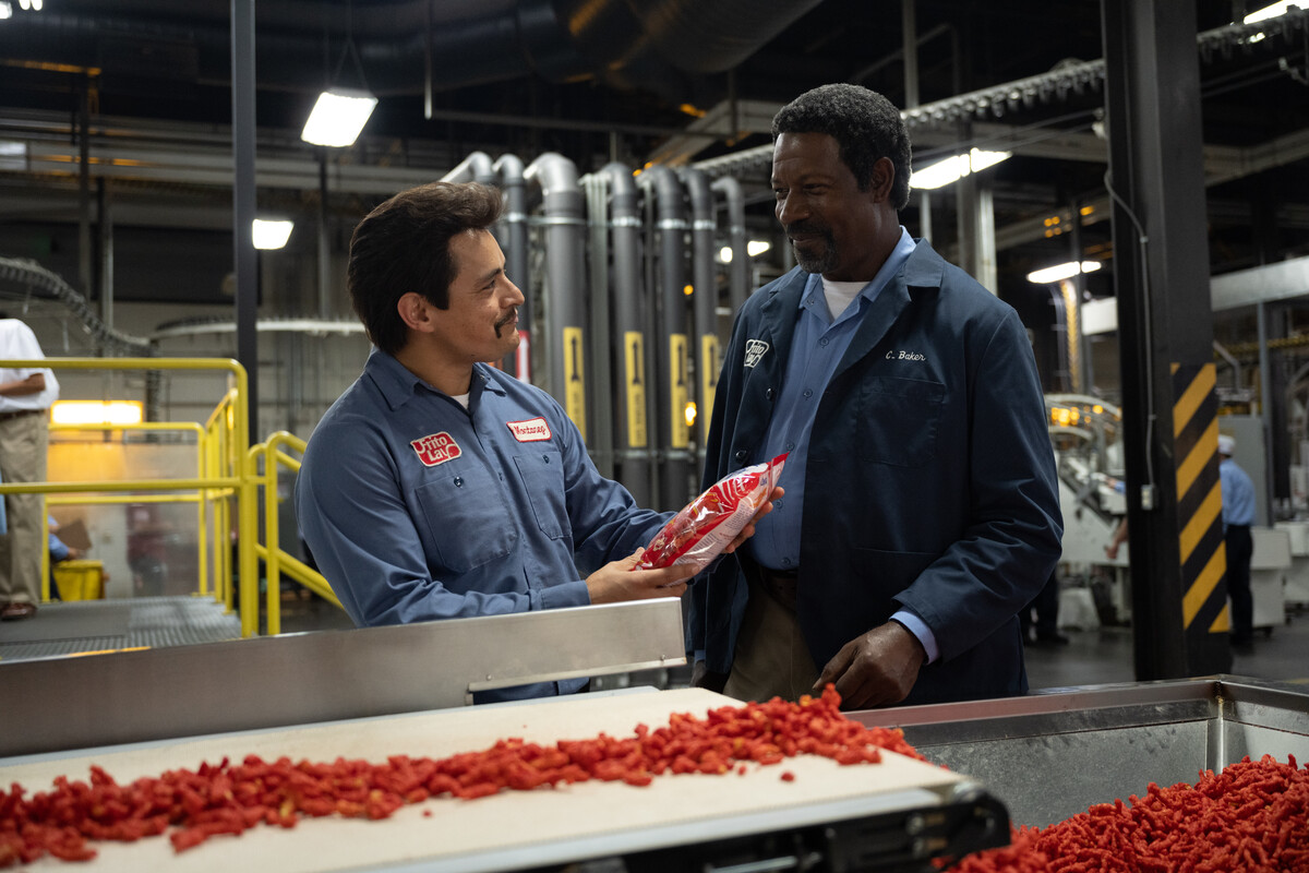 Jesse Garcia and Dennis Haysbert in FLAMIN’ HOT. Photo by Anna Kooris. Courtesy of Searchlight Pictures. © 2023 20th Century Studios All Rights Reserved.