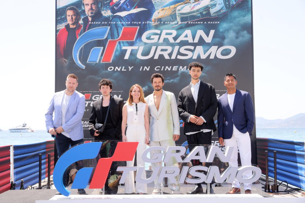 CANNES, FRANCE - MAY 26: GRAN TURISMO: THE MOVIE cast, (L-R) Neill Blomkamp, Maximilian Mundt, Geri Halliwell, Orlando Bloom, Archie Madekwe and Asad Qizilbash attend the 2023 Cannes Film Festival Photo Call on May 26, 2023 in Cannes, France. (Photo by Victor Boyko/Getty Images for Sony Pictures )