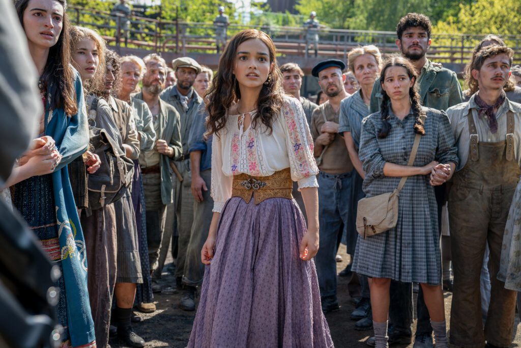 Honor Gillies as Barb Azure, Konstantin Taffet as Clerk Carmine and Rachel Zegler as Lucy Gray Baird in The Hunger Games: The Ballad of Songbirds and Snakes. Photo Credit: Murray Close