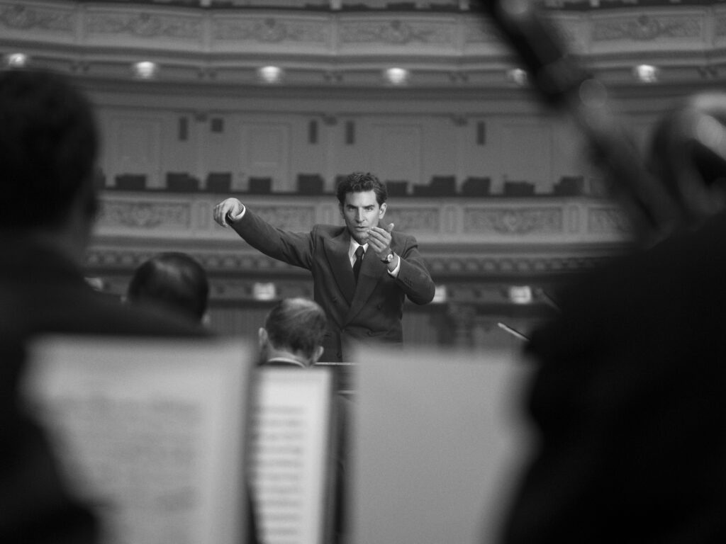 Maestro. Bradley Cooper as Leonard Bernstein (Director/Writer) in Maestro. Cr. Jason McDonald/Netflix © 2023.