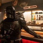 (L-R) Mandalorian (Pedro Pascal) and Grogu in Lucasfilm's THE MANDALORIAN AND GROGU. Photo by Nicola Goode. © 2025 Lucasfilm Ltd™. All Rights Reserved.
