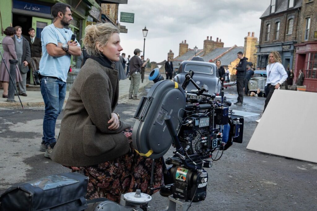 NARNIA: THE MAGICIAN'S NEPHEW. Writer/Director Greta Gerwig with crew members on the set of Narnia: The Magician’s Nephew. Cr. Peter Mountain/Netflix © 2026.