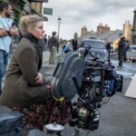NARNIA: THE MAGICIAN'S NEPHEW. Writer/Director Greta Gerwig with crew members on the set of Narnia: The Magician’s Nephew. Cr. Peter Mountain/Netflix © 2026.